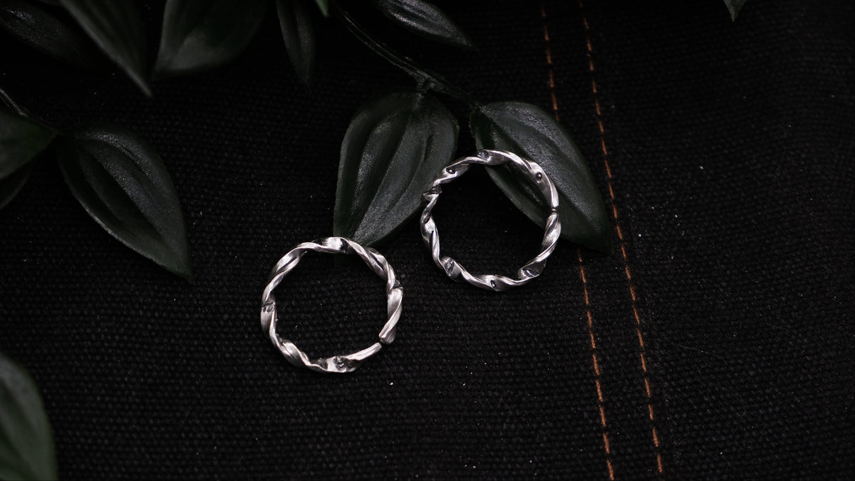 Hand wearing handmade silver rings